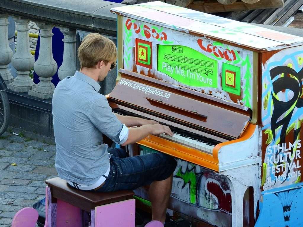 novice playing a pinaoforte as an apprentice